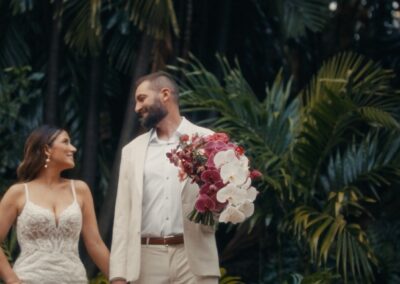 Bride and groom portrait in tropical greenery